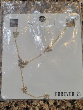 BNWT Sealed gold colored butterfly lariat necklace women's/ girls new with tags